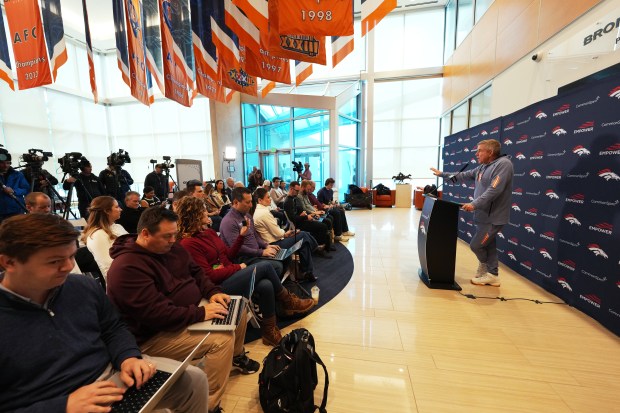 Denver Broncos head coach Sean Payton, right, responds to question during a season-ending news conference Tuesday, Jan. 27, 2026, at the NFL football team's headquarters in Centennial, Colo. (AP Photo/David Zalubowski)