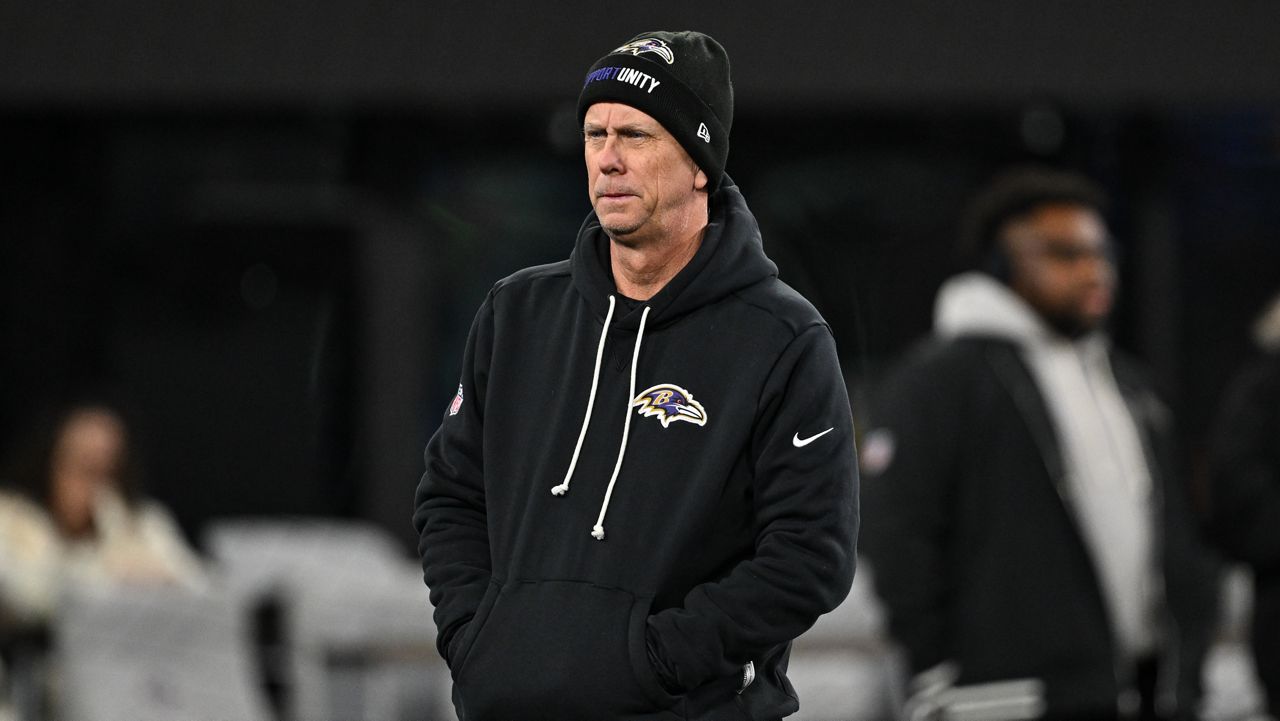 Baltimore Ravens offensive coordinator Todd Monken looks on during pre-game warm-ups before an NFL football game against the New England Patriots, Sunday, Dec. 21, 2025, in Baltimore.