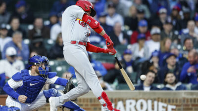 May 8, 2023; Chicago, Illinois, USA; St. Louis Cardinals center fielder Dylan Carlson (3) hits an RBI-single against the Chicago Cubs during the second inning at Wrigley Field.