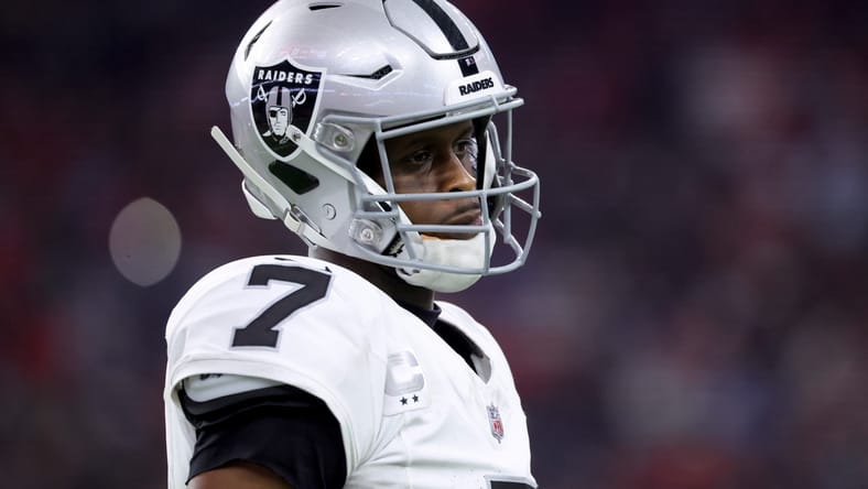 Geno Smith looks toward the sideline during a Raiders game.