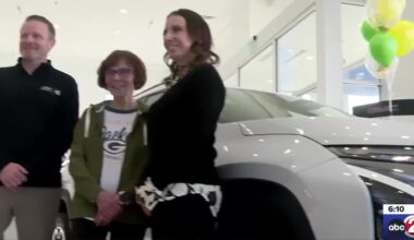 Packers fan picks up their new car after winning it at a game