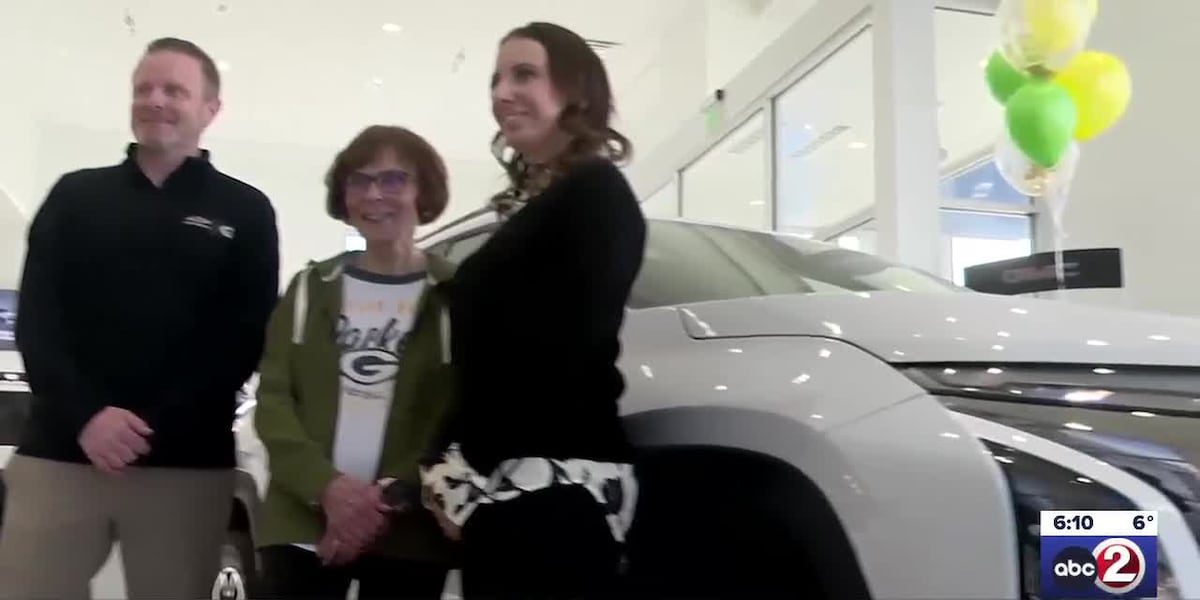 Packers fan picks up their new car after winning it at a game