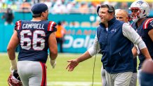Patriots offensive tackle Will Campbell and head coach Mike Vrabel