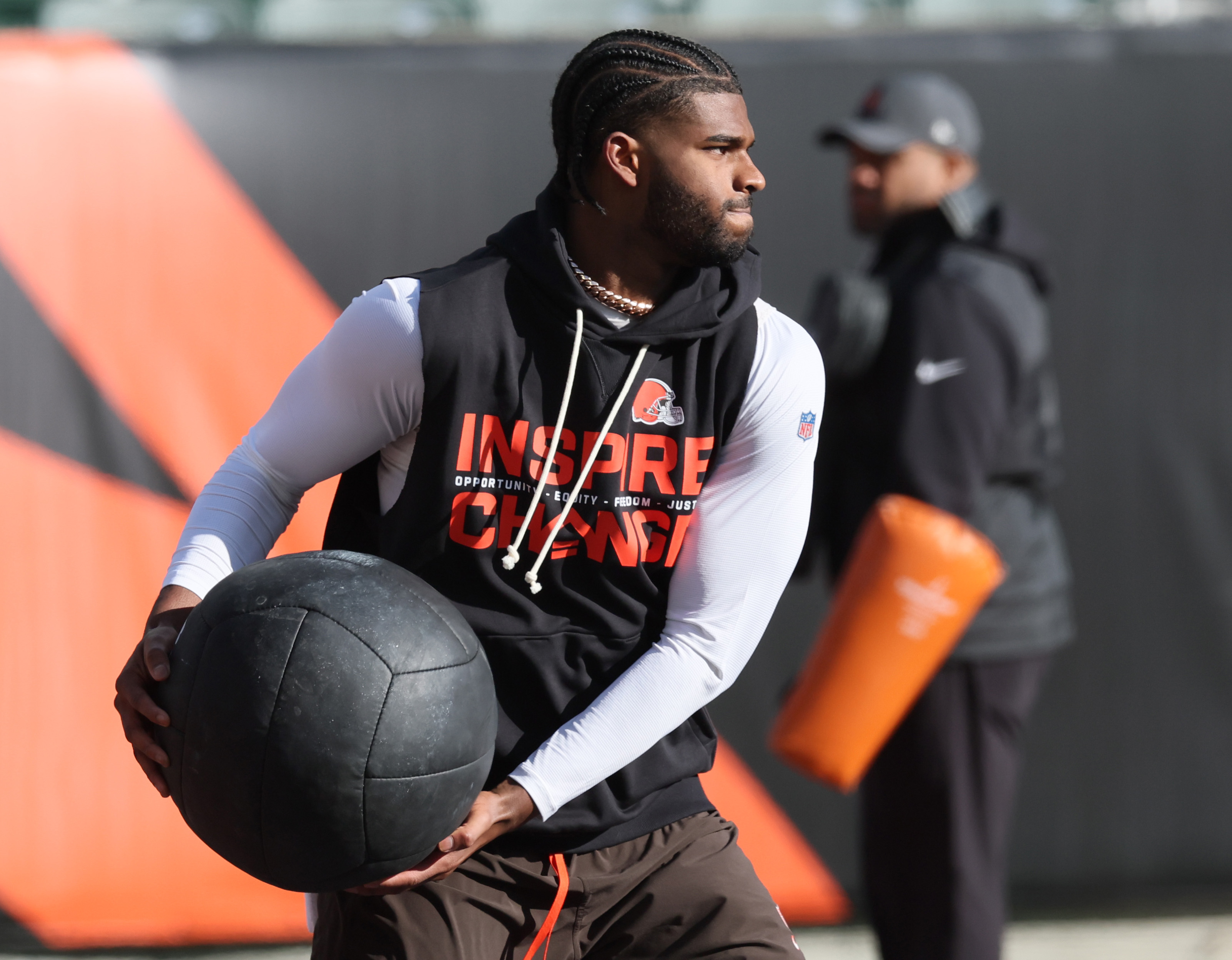 Cleveland Browns quarterback Shedeur Sanders throws a heabvy ball in warm ups before their game against the Cincinnati Bengals.  