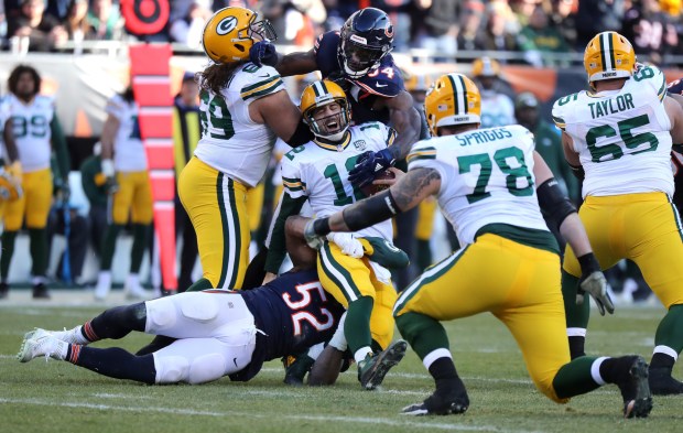 Bears linebackers Khalil Mack, No. 52, and Leonard Floyd sack Packers quarterback Aaron Rodgers in the fourth quarter on Dec. 16, 2018, at Soldier Field.