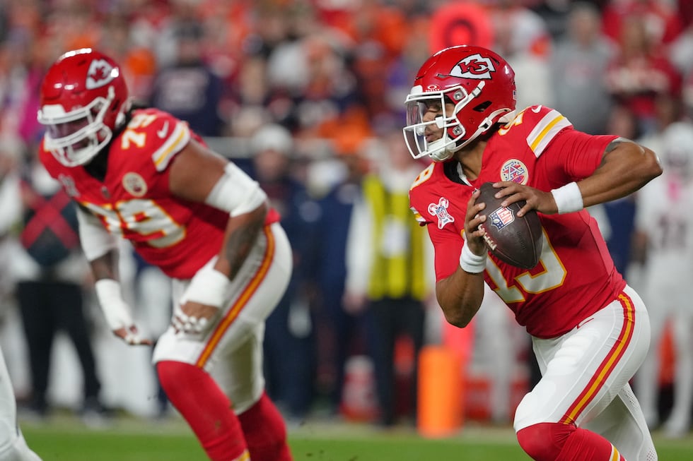 Kansas City Chiefs quarterback Chris Oladokun, right, looks to pass against the Denver Broncos...
