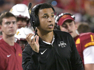 Iowa State running game coordinator Nate Scheelhaase, center, gives instructions from the sideline during the first half of the Cheez-It Bowl NCAA college football game against Clemson, Wednesday, Dec. 29, 2021, in Orlando, Fla.