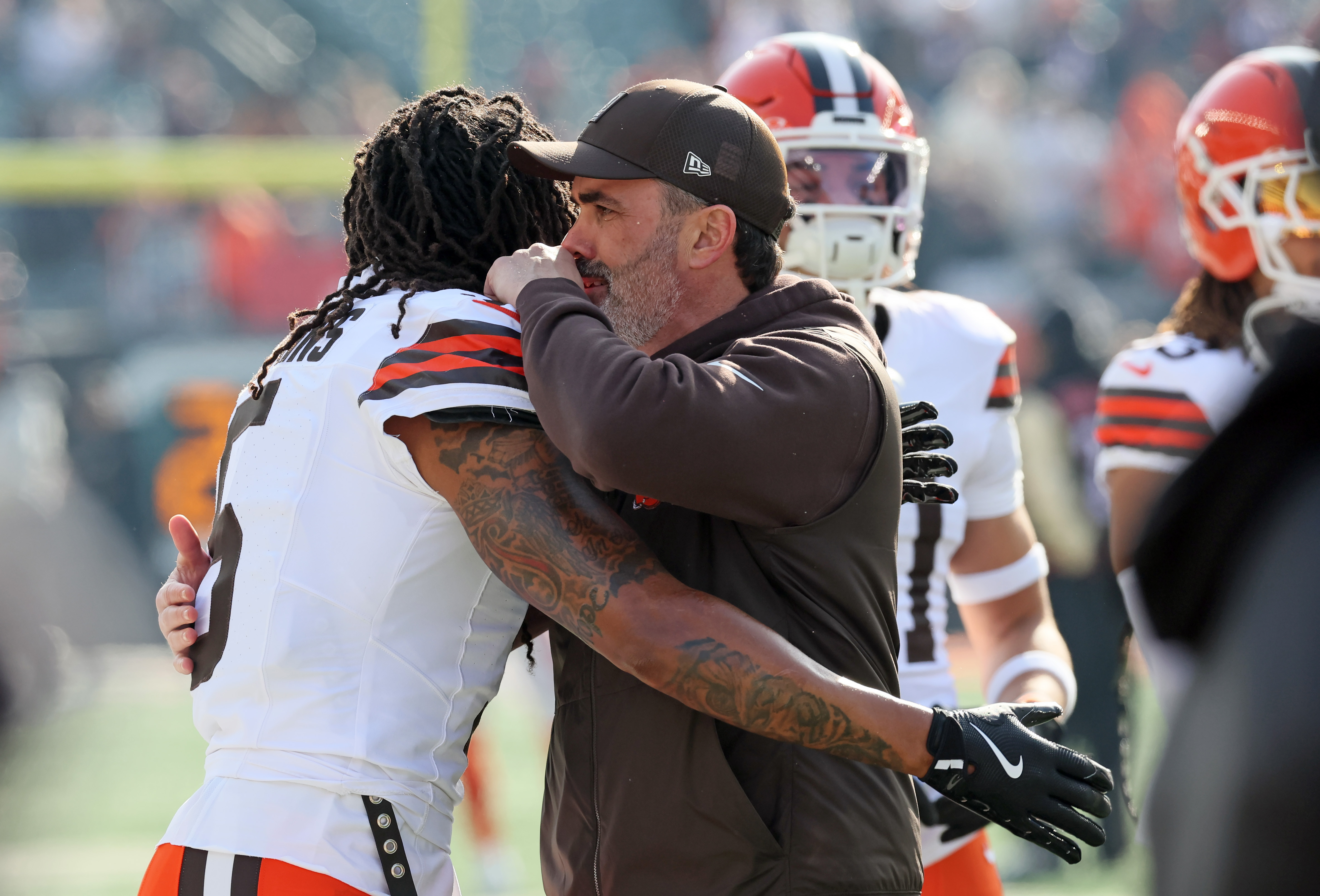 Cleveland Browns safety Rayshawn Jenkins hugs Cleveland Browns head coach Kevin Stefanski during warm ups before the game against the Cincinnati Bengals. 
