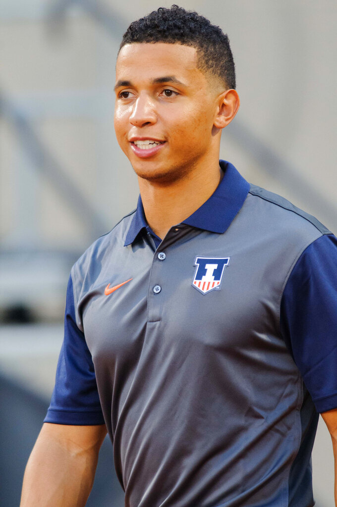 Illinois running backs coach Nathan Scheelhaase watches players warm up for an NCAA football game against Kent State on Friday, Sept. 4, 2015, at Memorial Stadium in Champaign, Ill. 