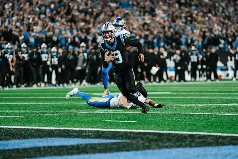 Bryce young runs one in during Saturday's wild card game against the Rams.
