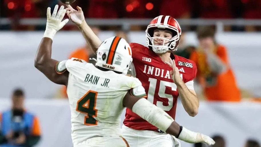 Miami Hurricanes defensive lineman Rueben Bain Jr. (4) defends against Indiana Hoosiers quarterback Fernando Mendoza