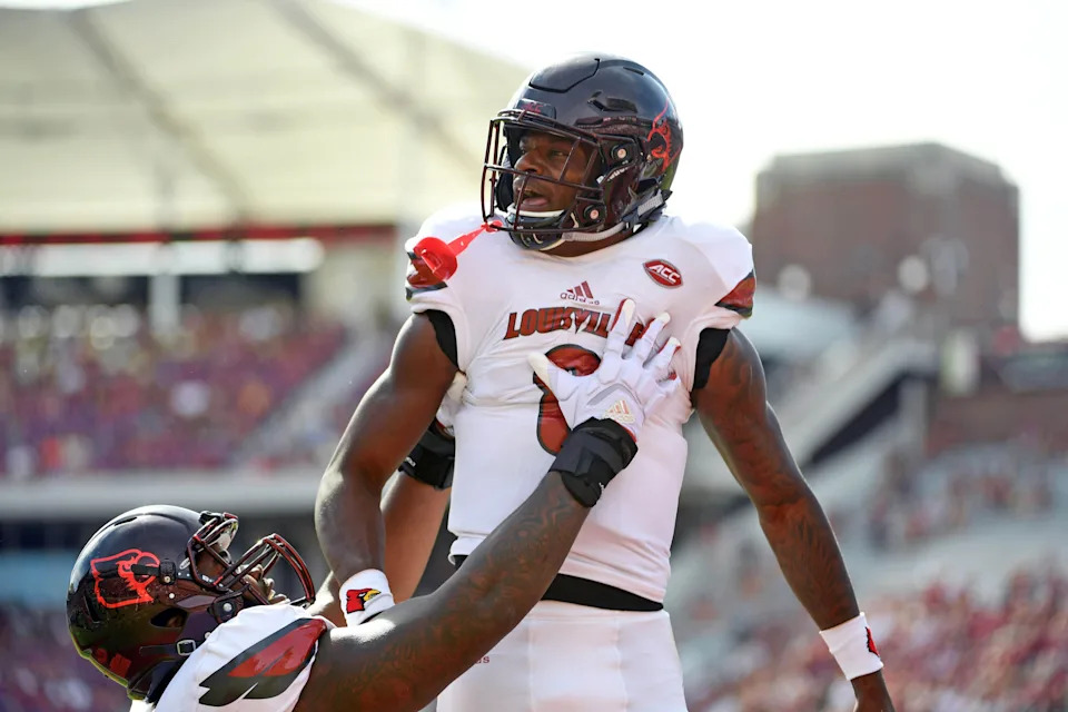 Oct 21, 2017; Tallahassee, FL, USA; Louisville Cardinals quarterback Lamar Jackson (8) celebrates a touchdown during the first half of the game against the Florida State Seminoles at Doak Campbell Stadium. Mandatory Credit: Melina Vastola-USA TODAY Sports