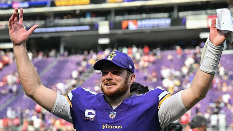 Sam Darnold reacting after a Vikings game at U.S. Bank Stadium