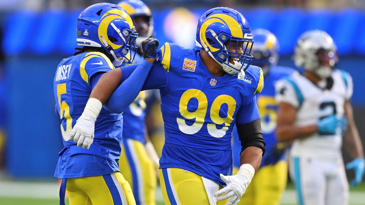 Los Angeles Rams cornerback Jalen Ramsey left, celebrates his sack on Carolina Panthers quarterback PJ Walker with defensive tackle Aaron Donald (99) during the second half of an NFL football game Sunday, Oct. 16, 2022, in Inglewood, Calif. (AP Photo/Jayne Kamin-Oncea)