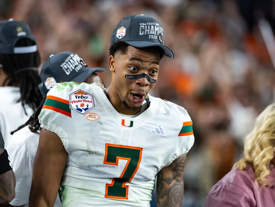 Jan 8, 2026; Glendale, AZ, USA; Miami Hurricanes wide receiver CJ Daniels (7) celebrates after defeating the Mississippi Rebels during the 2026 Fiesta Bowl and semifinal game of the College Football Playoff at State Farm Stadium. Mandatory Credit: Mark J. Rebilas-Imagn Images