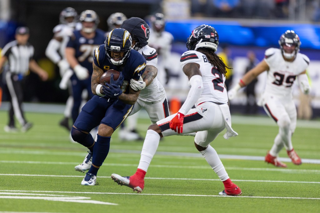 Keenan Allen of the Chargers running with the football during a game.