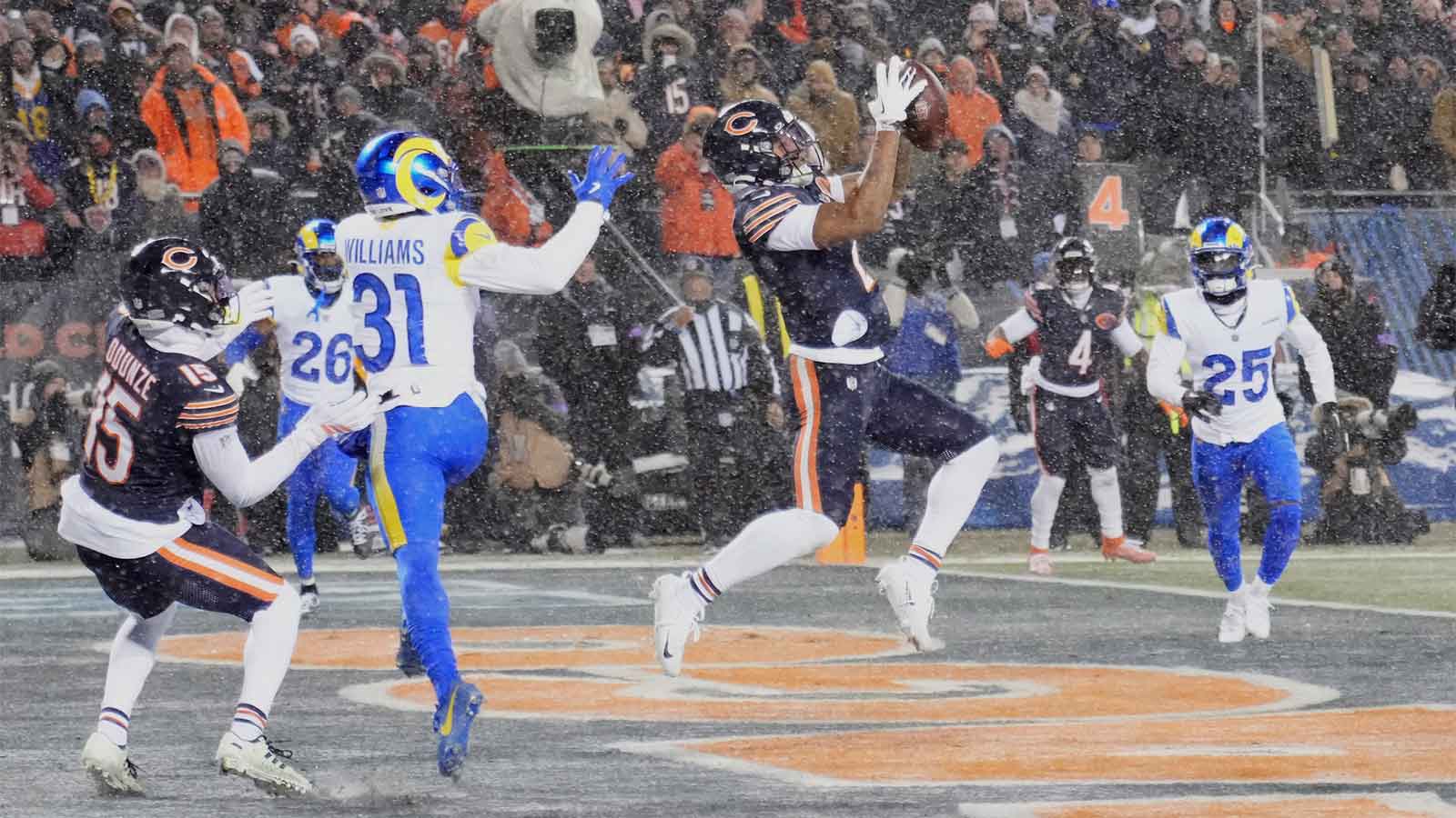 Jan 18, 2026; Chicago, IL, USA; Chicago Bears wide receiver DJ Moore (2) catches a three-yard touchdown pass thrown by quarterback Caleb Williams (not pictured) against Los Angeles Rams cornerback Darious Williams (31) during the second quarter of an NFC Divisional Round game at Soldier Field. Mandatory Credit: David Banks-Imagn Images