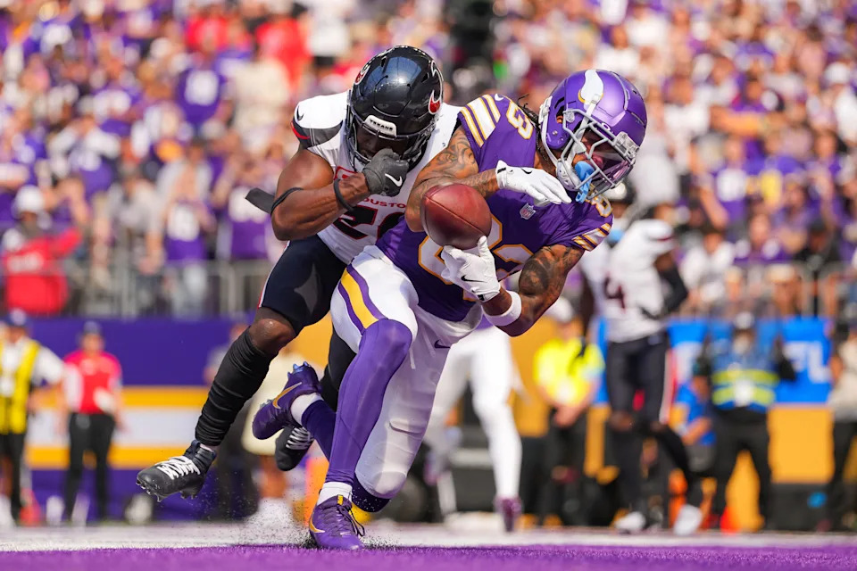 Sep 22, 2024; Minneapolis, Minnesota, USA; Minnesota Vikings wide receiver Jalen Nailor (83) catches a pass for a touchdown against the Houston Texans safety Jimmie Ward (20) in the third quarter at U.S. Bank Stadium. Mandatory Credit: Brad Rempel-Imagn Images
