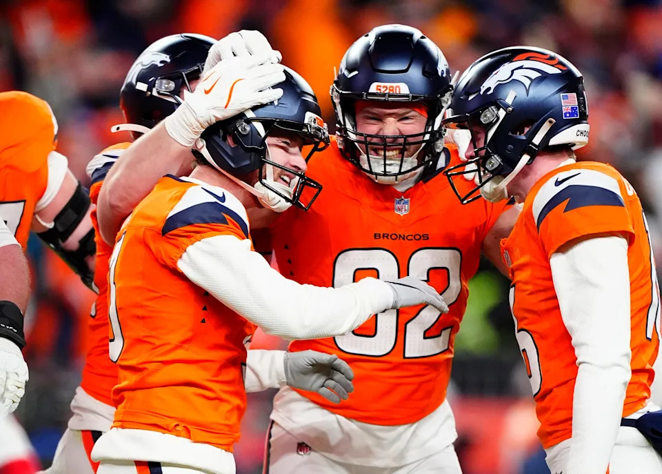 Jan 17, 2026; Denver, CO, USA; Denver Broncos place kicker Wil Lutz (3) celebrates with tight end Adam Trautman (82) and punter Jeremy Crawshaw (16) after kicking a game-winning field goal during overtime of an AFC Divisional Round playoff game against the Buffalo Bills at Empower Field at Mile High. Mandatory Credit: Ron Chenoy-Imagn Images