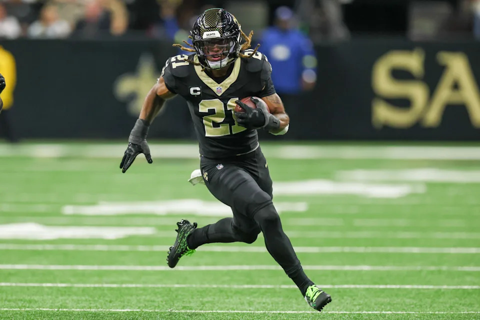 New Orleans Saints safety Justin Reid (21) carries the ball for a touchdown after making an interception against the Atlanta Falcons.Stephen Lew-Imagn Images