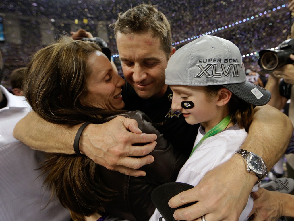 John Harbaugh embraces his wife Ingrid and daughter Alison after the Super Bowl XLVII victory.
