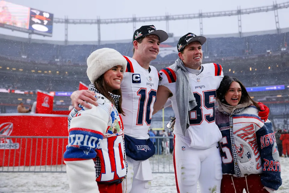 DENVER, COLORADO - JANUARY 25: Drake Maye #10 and Hunter Henry #85 of the New England Patriots pose for a photo following the AFC Championship Playoff game against the Denver Broncos at Empower Field At Mile High on January 25, 2026 in Denver, Colorado. The New England Patriots defeat the Denver Broncos 10-7. (Photo by Justin Edmonds/Getty Images)