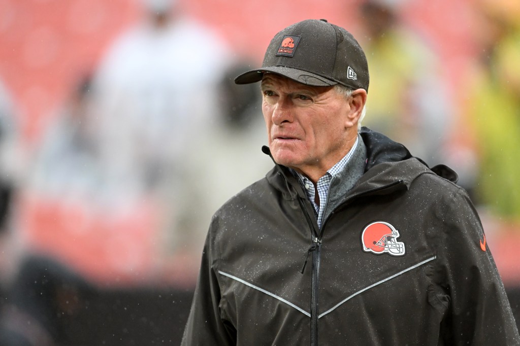 Cleveland Browns General Manager Andrew Berry watches the game in the rain.