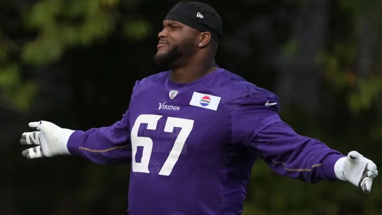 Vikings guard Ed Ingram works through drills during practice in Watford, England. Vikings myths and misses