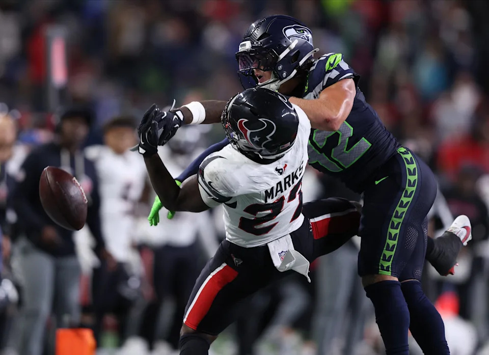 Seattle Seahawks linebacker Drake Thomas breaks up a pass intended for Houston Texans running back Woody Marks.