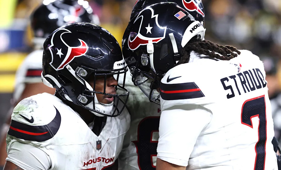 Jan 12, 2026; Pittsburgh, PA, USA; Houston Texans running back Woody Marks (27) and quarterback C.J. Stroud (7) celebrate after a touchdown during the second half of an AFC Wild Card Round game against the Pittsburgh Steelers at Acrisure Stadium. Mandatory Credit: Charles LeClaire-Imagn Images