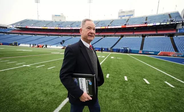 Chris Clark, Buffalo Bills Vice President of Security walks on the field at Highmark Stadium before an NFL football game between the Philadelphia Eagles and Buffalo Bills, Sunday, Dec. 28, 2025. (AP Photo/Gene J. Puskar)