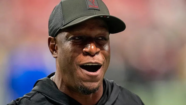 Raheem Morris on the field before a Falcons game at Mercedes-Benz Stadium. Vikings defensive coordinator candidates.