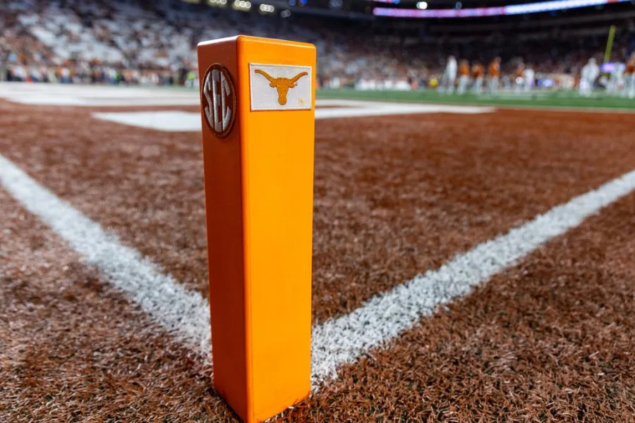 The Texas and SEC logos adorn an end zone marker ahead of an NCAA college football game against Texas A&M, Friday, Nov. 28, 2025, in Austin, Texas. (AP Photo/Stephen Spillman)