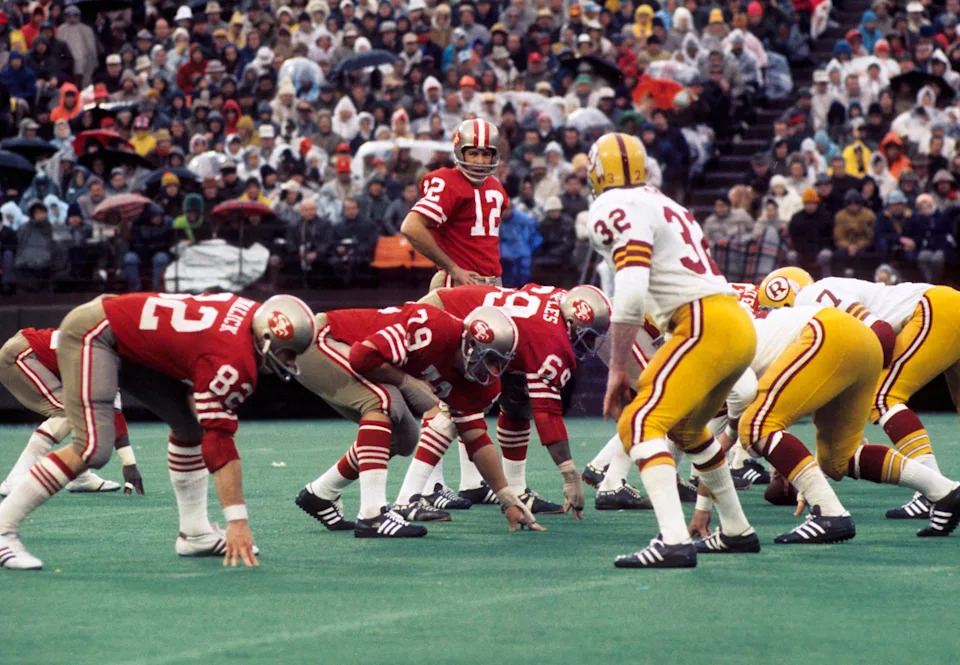 San Francisco 49ers quarterback John Brodie at the line of scrimmage against Washington.