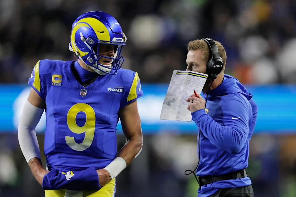 Los Angeles Rams head coach Sean McVay talks with quarterback Matthew Stafford (9) during the first half
