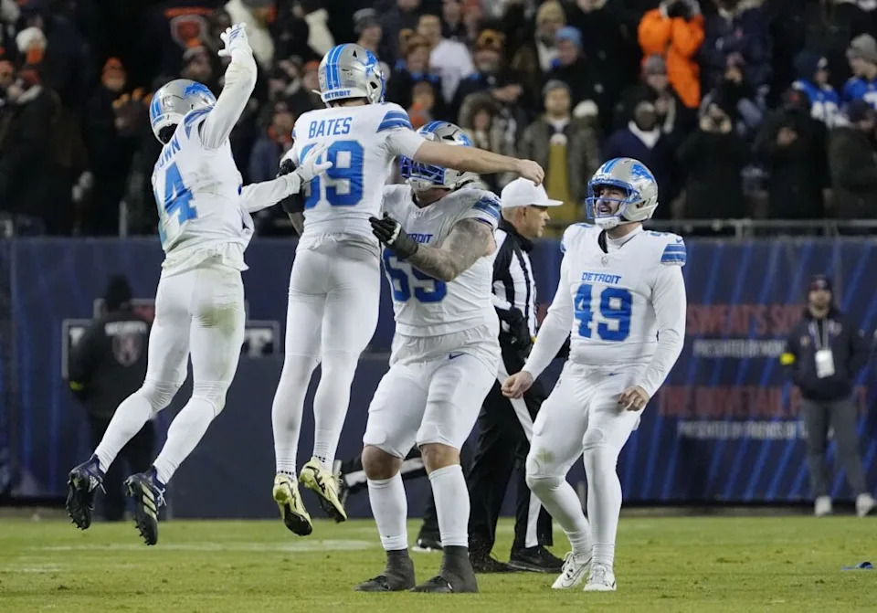 Jan 4, 2026; Chicago, Illinois, USA; Detroit Lions place kicker Jake Bates (39) celebrates with teammates after kicking a game-winning field goal against the Chicago Bears at Soldier Field. Mandatory Credit: David Banks-Imagn Images
