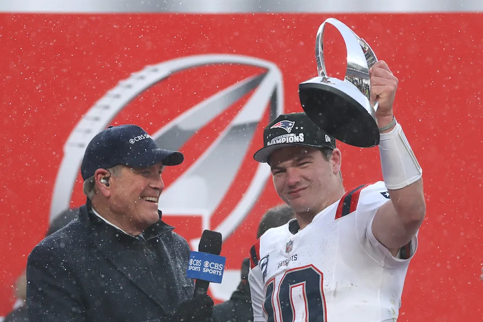 DENVER, COLORADO - JANUARY 25: Drake Maye #10 of the New England Patriots celebrates with the Lamar Hunt Trophy during the Trophy Presentation of the AFC Championship Playoff game against the Denver Broncos at Empower Field At Mile High on January 25, 2026 in Denver, Colorado. The New England Patriots defeat the Denver Broncos 10-7. (Photo by Matthew Stockman/Getty Images)