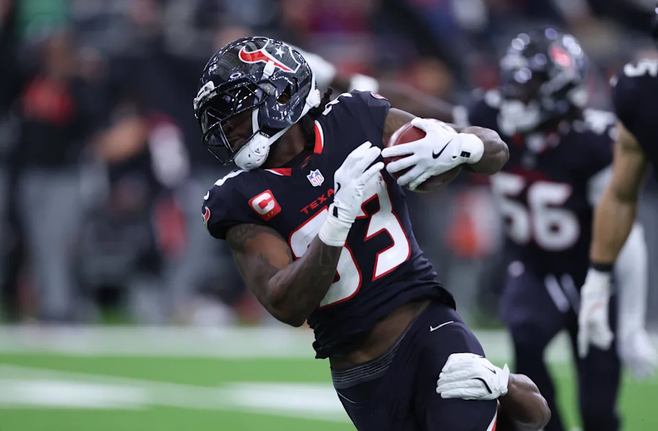 Dec 14, 2025; Houston, Texas, USA; Houston Texans running back Dare Ogunbowale (33) recovers a fumble during the first quarter against the Arizona Cardinals at NRG Stadium. Mandatory Credit: Troy Taormina-Imagn Images