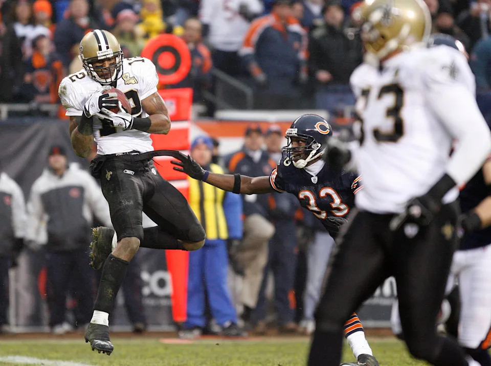 New Orleans Saints wide receiver Marques Colston (12) hauls in a touchdown pass over Chicago Bears cornerback Charles Tillman.