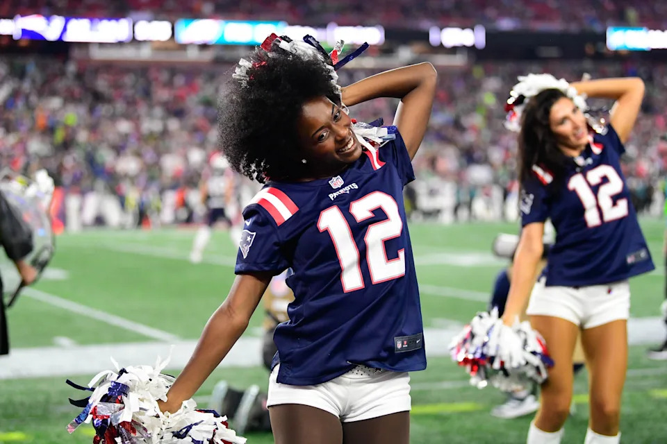 A New England Patriots cheerleader entertains fans during a break in action during the second half against the Philadelphia Eagles at Gillette Stadium.