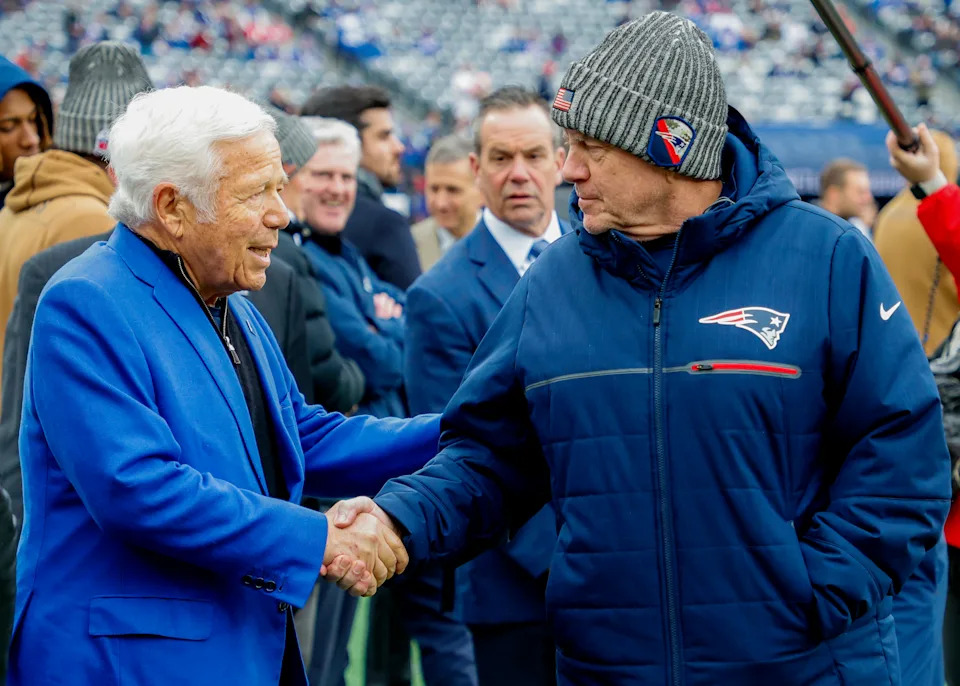 East Rutherford, NJ - November 26: New England Patriots head coach Bill Belichick shakes hands with owner Robert Kraft before the game. The Patriots lost to the New York Giants, 10-7. (Photo by Matthew J. Lee/The Boston Globe via Getty Images)