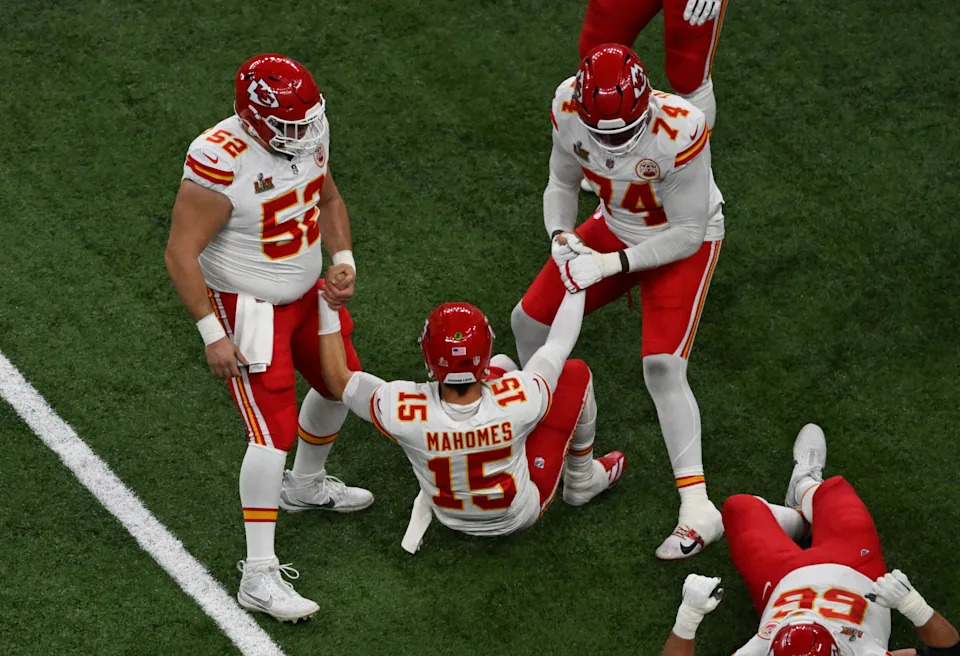 Kansas City Chiefs' offensive lineman #52 Creed Humphrey and Kansas City Chiefs' tackle #74 Jawaan Taylor help Kansas City Chiefs' quarterback #15 Patrick Mahomes up after he was tackled during Super Bowl LIX between the Kansas City Chiefs and the Philadelphia Eagles at Caesars Superdome in New Orleans, Louisiana, February 9, 2025. (Photo by Chandan Khanna / AFP) (Photo by CHANDAN KHANNA/AFP via Getty Images)