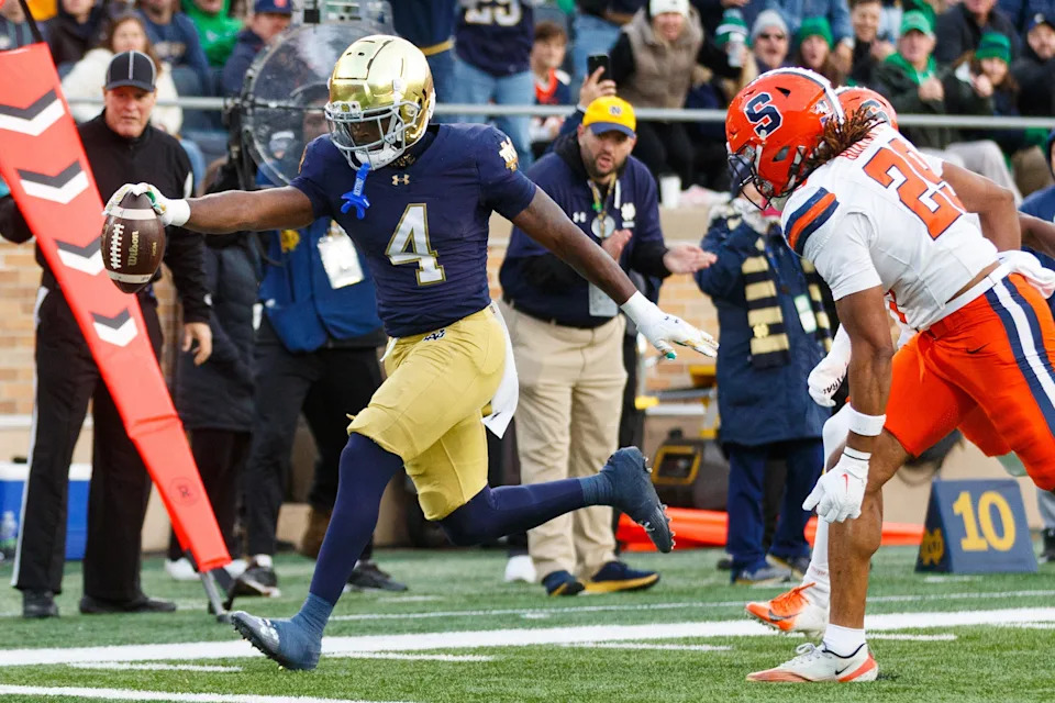 Notre Dame running back Jeremiyah Love (4) runs the ball into the end zone for a touchdown in the first half of a NCAA football game against Syracuse at Notre Dame Stadium on Saturday, Nov. 22, 2025, in South Bend.