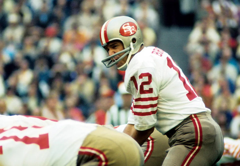 San Francisco 49ers quarterback John Brodie at the line of scrimmage against the St. Louis Cardinals at Busch Stadium.