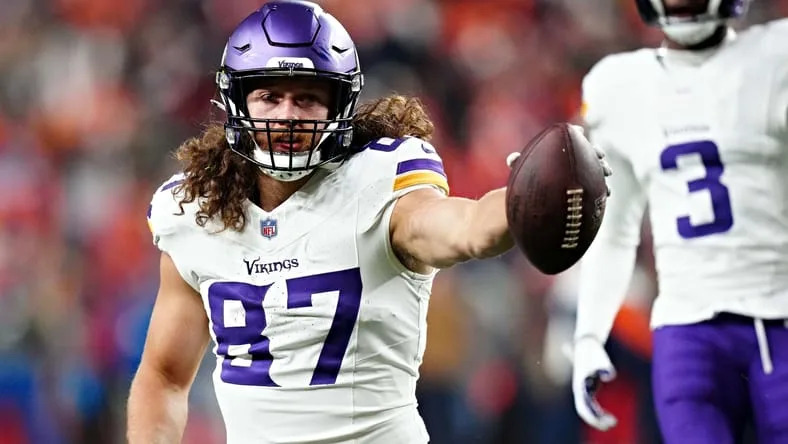 T.J. Hockenson reacts after a catch against the Broncos