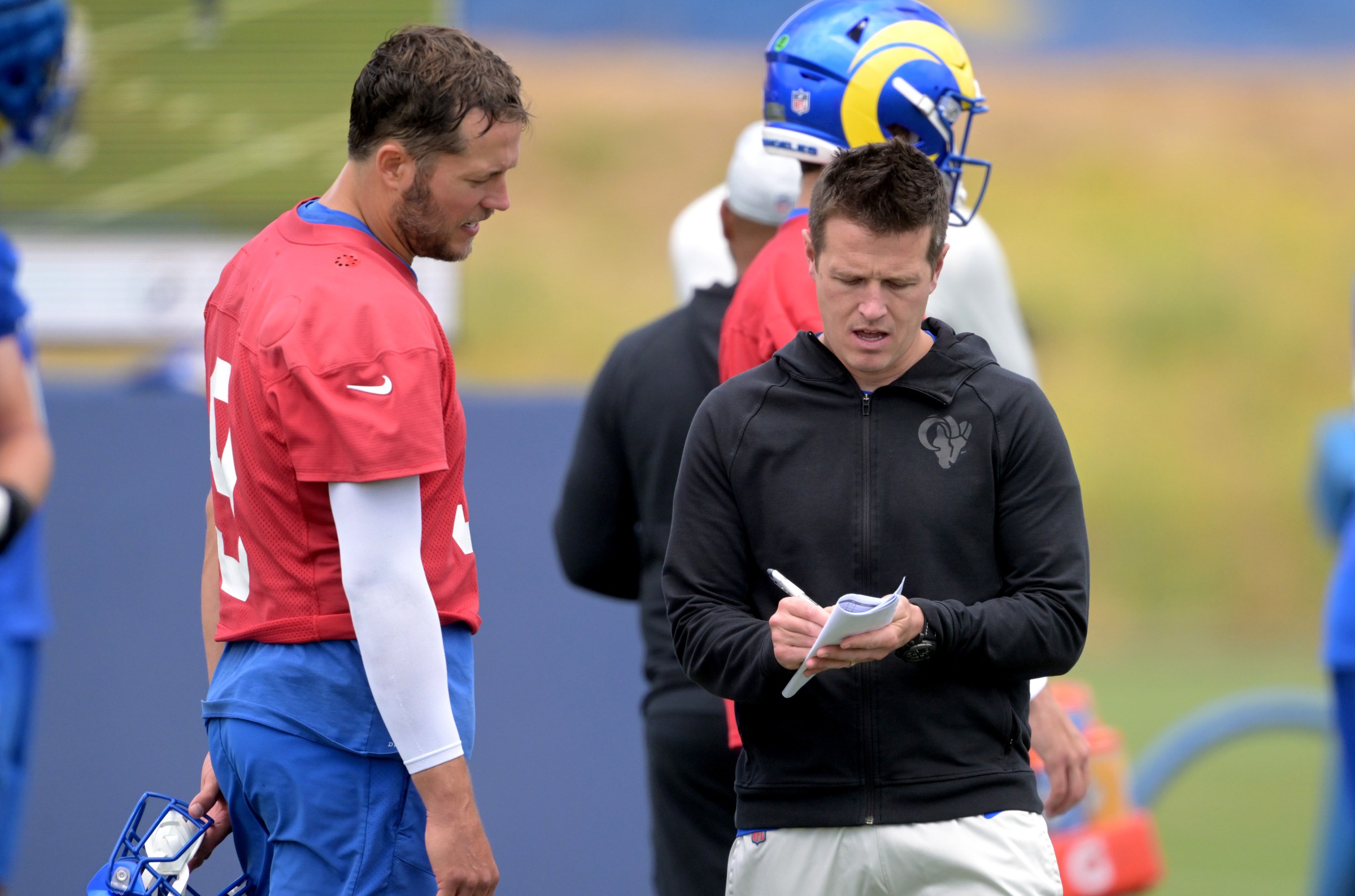Quarterback Matthew Stafford #9 talks with offensive coordinator Mike LaFleur of the Los Angeles Rams