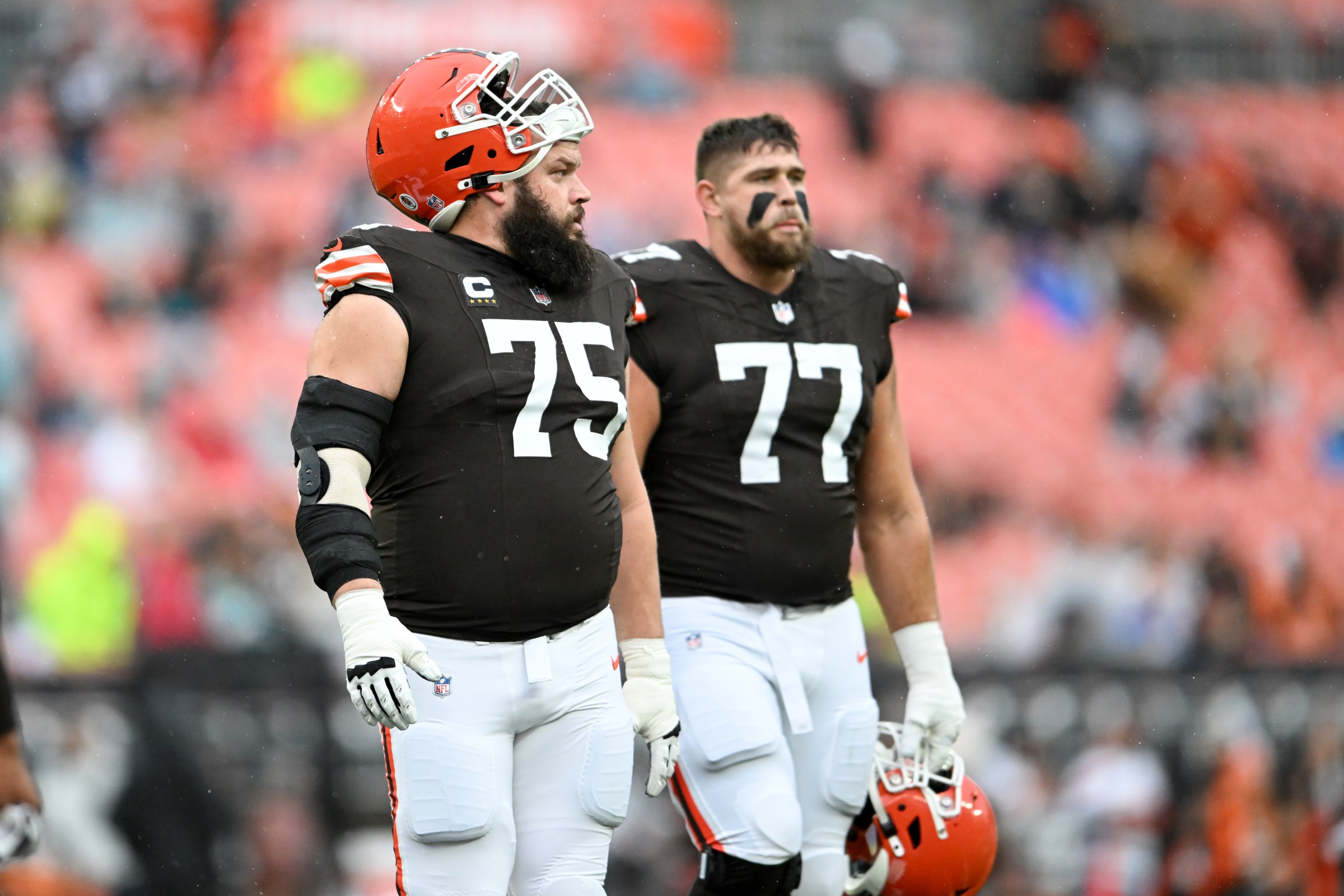 CLEVELAND, OHIO - DECEMBER 29: Joel Bitonio #75 and Wyatt Teller #77 of the Cleveland Browns look on prior to a game against the Miami Dolphins at Huntington Bank Field on December 29, 2024 in Cleveland, Ohio. (Photo by Nick Cammett/Diamond Images via Getty Images)