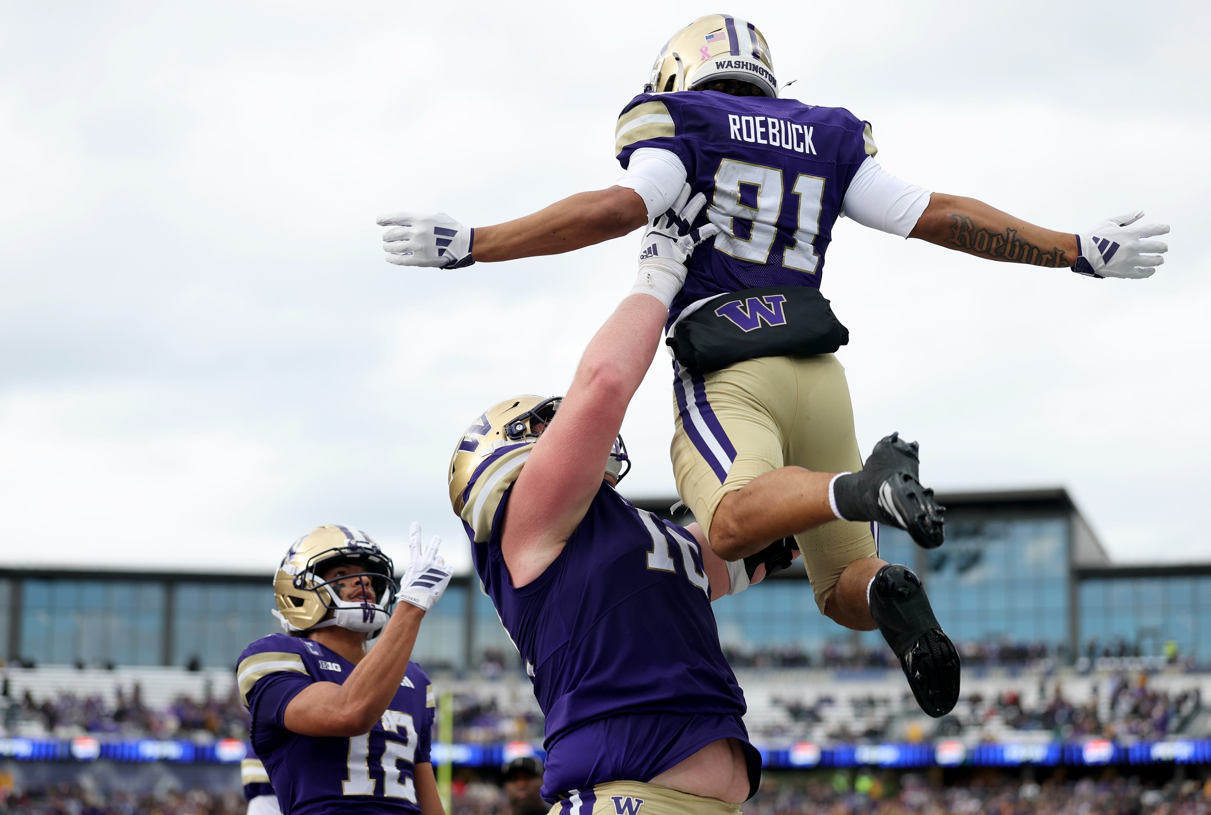SEATTLE, WASHINGTON - OCTOBER 25: Dezmen Roebuck #81 of the Washington Huskies celebrates his touchdown catch against the Illinois Fighting Illini during the first half at Husky Stadium on October 25, 2025 in Seattle, Washington. (Photo by Steph Chambers/Getty Images)