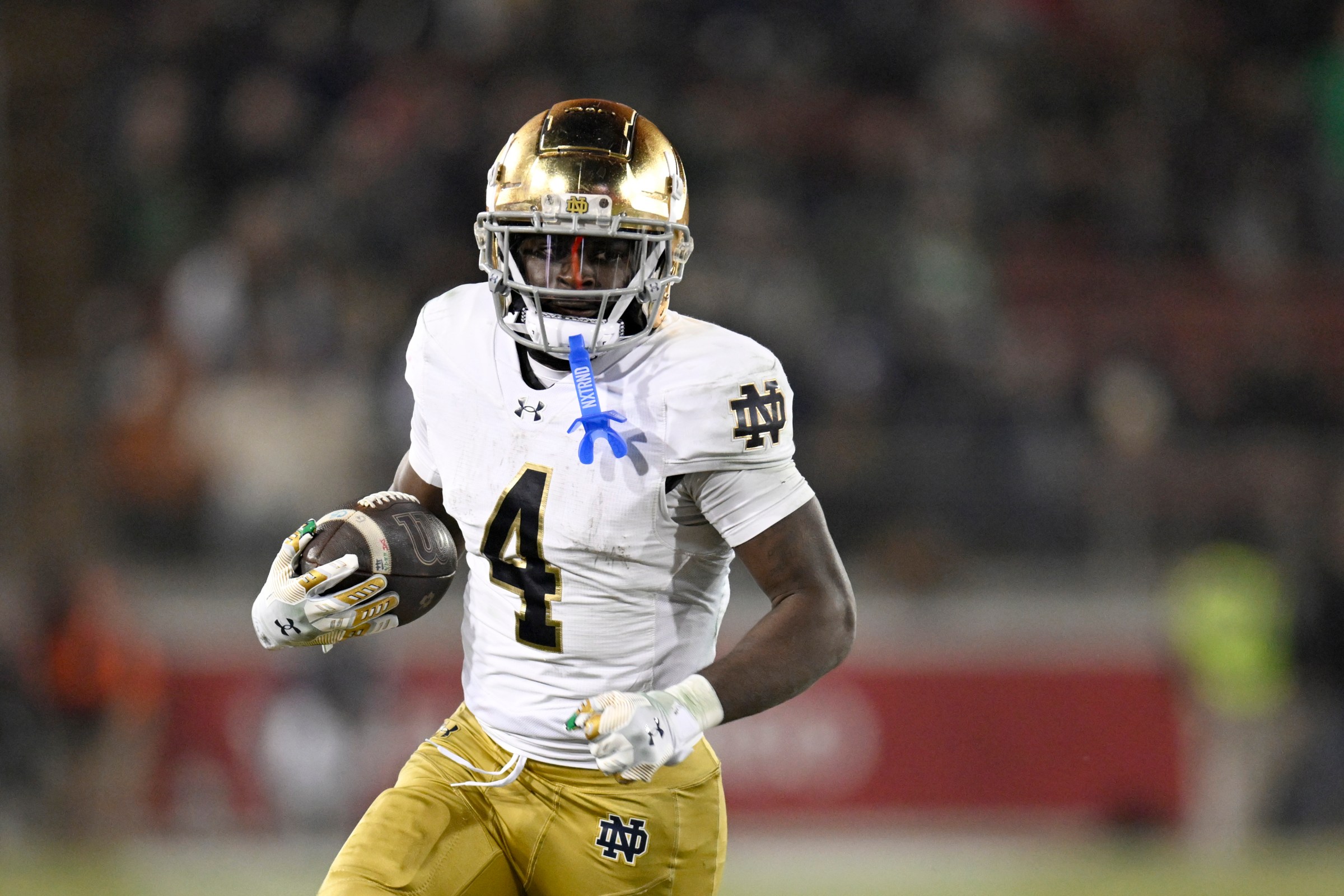 STANFORD, CALIFORNIA - NOVEMBER 29: Jeremiyah Love #4 of the Notre Dame Fighting Irish runs the ball against the Stanford Cardinal in the third quarter at Stanford Stadium on November 29, 2025 in Stanford, California. (Photo by Eakin Howard/Getty Images)