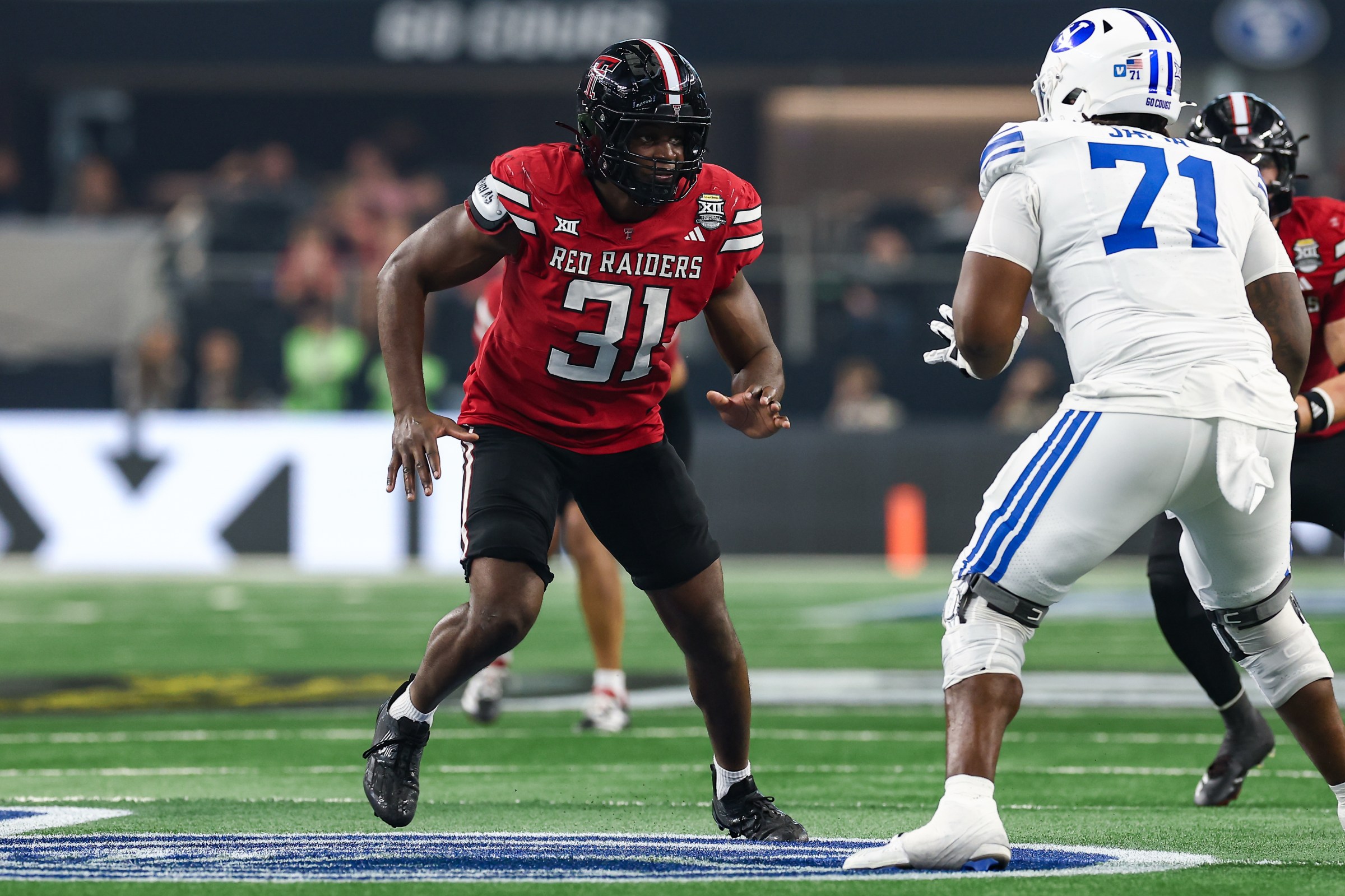 ARLINGTON, TX - DECEMBER 06: Texas Tech Red Raiders defensive end David Bailey (#31) runs up field during the Big 12 Championship Game between the Texas Tech Red Raiders and BYU Cougars on December 6, 2025 at Amon G. Carter Stadium in Fort Worth, TX. (Photo by Matthew Visinsky/Icon Sportswire via Getty Images)